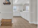 Spacious entryway featuring ceramic tile flooring, white walls and woodwork, and built-in shelving at 5801 Oyster Catcher Dr. # 1621, North Myrtle Beach, SC 29582