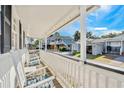 Relaxing porch with white rocking chairs offers a tranquil outdoor space at 6001- 1776 S Kings Highway, Myrtle Beach, SC 29575