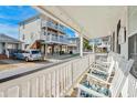 Spacious porch with rocking chairs, perfect for enjoying the neighborhood views at 6001- 1776 S Kings Highway, Myrtle Beach, SC 29575