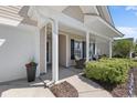 Inviting front porch with seating area and neat landscaping near an attached garage at 680 Twinflower St., Little River, SC 29566