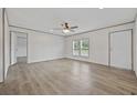 Bright living room features wood-look flooring and a ceiling fan at 7019 Norton Rd., Green Sea, SC 29545