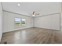 Bright living room features wood-look flooring and a ceiling fan at 7019 Norton Rd., Green Sea, SC 29545