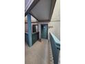 Condominium entrance featuring a teal door with a painted sign and carpeted walkway at 9540 Shore Dr. # 1N, Myrtle Beach, SC 29572