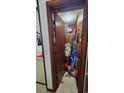 A utility storage closet filled with miscellaneous household items and cleaning supplies at 9540 Shore Dr. # 1N, Myrtle Beach, SC 29572