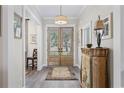 Welcoming foyer featuring wood-look floors and decorative console table at 1028 Whooping Crane Dr., Conway, SC 29526
