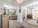 Open-concept home featuring wood-look floors connecting living areas and dining space at 1028 Whooping Crane Dr., Conway, SC 29526