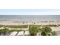 Beautiful beach front with beach access, palm trees and blue umbrellas at 1105 S Ocean Blvd. # 630, Myrtle Beach, SC 29577