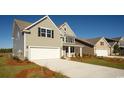 Beautiful two-story home featuring an attached two-car garage, driveway and charming curb appeal at 1231 Barrington Way, Conway, SC 29526