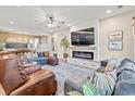 Living room with fireplace, large TV, and comfortable seating, creating a cozy atmosphere at 127 Emerald Rush Ct., Longs, SC 29568