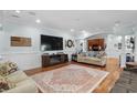 Inviting living room featuring hardwood floors, media center, and ample space for relaxation and entertaining at 130 Pier Pointe Dr., Little River, SC 29566