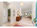 Bright entryway featuring neutral paint, carpet, and stylish decor leading into the living area at 1617 Tradition Club Dr., Pawleys Island, SC 29585
