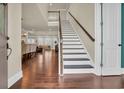 Bright foyer with hardwood flooring, staircase, and a view of the living and dining area at 2004 Crow Field Ct., Myrtle Beach, SC 29579