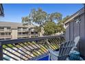Relaxing balcony featuring chairs with a view of the outdoor common areas at 204 Maison Dr. # N304, Myrtle Beach, SC 29572