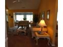 Comfortable living room showcasing plush furniture, a view to the outdoors, and cozy carpeting at 2333 Brick Dr., Longs, SC 29568