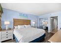 Bright bedroom with ocean view art, full closet and a comfortable queen bed at 2401 S Ocean Blvd. # 752, Myrtle Beach, SC 29577