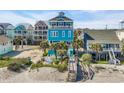Bright beach house with multiple balconies and walkways to the beach with lots of stairs at 2808 N Ocean Blvd., North Myrtle Beach, SC 29582