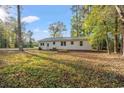 Expansive backyard with lush lawn and mature trees, perfect for outdoor activities at 3934 North Fraser St., Georgetown, SC 29440