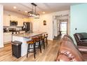 Modern kitchen featuring an island with seating, stainless steel appliances, and light-colored cabinets at 40 Parkside Dr., Pawleys Island, SC 29585
