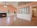 Spacious living room with a fireplace and large mirrors, complemented by modern flooring and neutral tones at 4300 Cross Cut Trail, Myrtle Beach, SC 29579