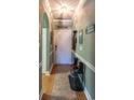 Inviting entryway with stylish decor, shoe rack, and calming color palette at 4741 Wild Iris Dr. # 303, Myrtle Beach, SC 29577