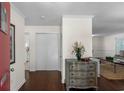 Inviting entryway with hardwood floors, complemented by a decorative chest and view into the living area at 617 Hibiscus Ave. # 617, Myrtle Beach, SC 29577