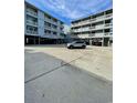 View of two elevated condo buildings with open parking beneath, providing ample space for residents at 625 North Waccamaw Dr. # 101, Murrells Inlet, SC 29576