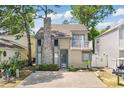 Inviting home with unique brick chimney and a quaint upper balcony for relaxing outdoors at 829 9Th Ave. S, North Myrtle Beach, SC 29582