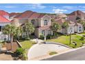 An elevated view showcases this beautiful home with a circular driveway and well-manicured lawn in a vibrant neighborhood at 837 Bluff View Dr., Myrtle Beach, SC 29579