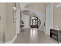 Elegant foyer featuring tile flooring, staircase, and decorative accents that create a welcoming ambiance at 837 Bluff View Dr., Myrtle Beach, SC 29579