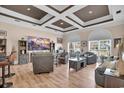 Spacious living room with coffered ceilings, hardwood floors, and natural light creates an inviting atmosphere at 837 Bluff View Dr., Myrtle Beach, SC 29579