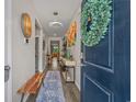 Inviting entryway featuring a wooden bench, stylish lighting, and modern decor at 1011 Maxwell Dr., Little River, SC 29566