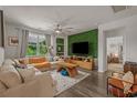Bright living room with a large sectional sofa and an accent wall at 1011 Maxwell Dr., Little River, SC 29566