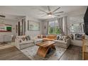 Spacious living room with a comfortable sectional, wooden coffee table, and natural light at 1011 Maxwell Dr., Little River, SC 29566
