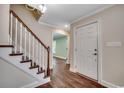 Inviting foyer with hardwood floors and a staircase leading to the upper level at 107 Azalea Dr., Conway, SC 29526