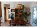 Inviting dining area with stylish light fixture, furniture and view to the outside at 1145 Forest Dr., North Myrtle Beach, SC 29582