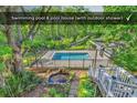 Swimming pool and pool house in a private backyard with lush landscaping at 130 Hagar Brown Rd., Murrells Inlet, SC 29576