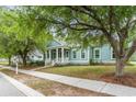 Beautifully landscaped home with a welcoming front porch and a well-maintained lawn at 1400 James Island Ave., North Myrtle Beach, SC 29582