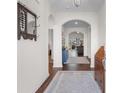 Bright foyer with hardwood floors and arched doorways leads into the living spaces at 194 Zostera Dr., Little River, SC 29566