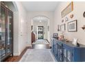 Inviting entrance features hardwood floors, arched doorway, and stylish decor at 194 Zostera Dr., Little River, SC 29566