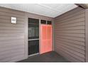 Exterior view of the front door to unit 321 featuring a screen door and storm door at 208 N Ocean Blvd. # 321, North Myrtle Beach, SC 29582