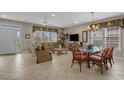 Bright living area with comfortable seating, large windows, and tile flooring at 215-B S Dogwood Dr., Surfside Beach, SC 29575