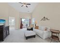 Bright living room with vaulted ceiling, ceiling fan, balcony access, and neutral decor at 217 Wando River Rd. # 12-H, Myrtle Beach, SC 29579