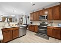 Modern kitchen with stainless steel appliances, wood cabinetry, a breakfast bar and ample counter space at 2170 Buxton Dr., Myrtle Beach, SC 29579
