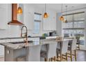 Modern kitchen features a large island, stainless steel appliances, and custom cabinets at 260 Palmetto Harbour Dr., North Myrtle Beach, SC 29582