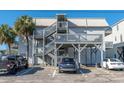 Condo building exterior with multiple outdoor staircases at 300 47Th Ave. S # 1E, North Myrtle Beach, SC 29582
