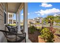 Relaxing front porch with comfortable seating and views of a landscaped front yard at 315 Cattle Drive Circle, Myrtle Beach, SC 29588