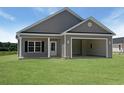 Stylish home with vertical siding and an attached two car garage for convenient parking at 3597 Valley Forge Rd., Aynor, SC 29511