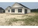A new construction home with white siding and black shutters also features an attached garage at 3601 Valley Forge Rd., Aynor, SC 29511