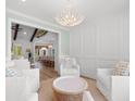 Elegant living room with white furnishings, decorative trim, and open layout at 4426 Still Pond Rd., Conway, SC 29526