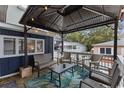 Relaxing outdoor living space featuring a covered patio with comfortable seating and stylish decor at 6001- 1771 S Kings Highway, Myrtle Beach, SC 29575